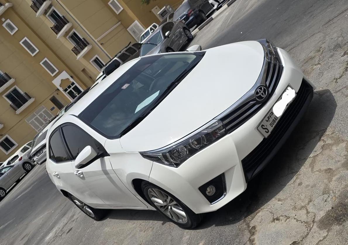 White Toyota Corolla sedan