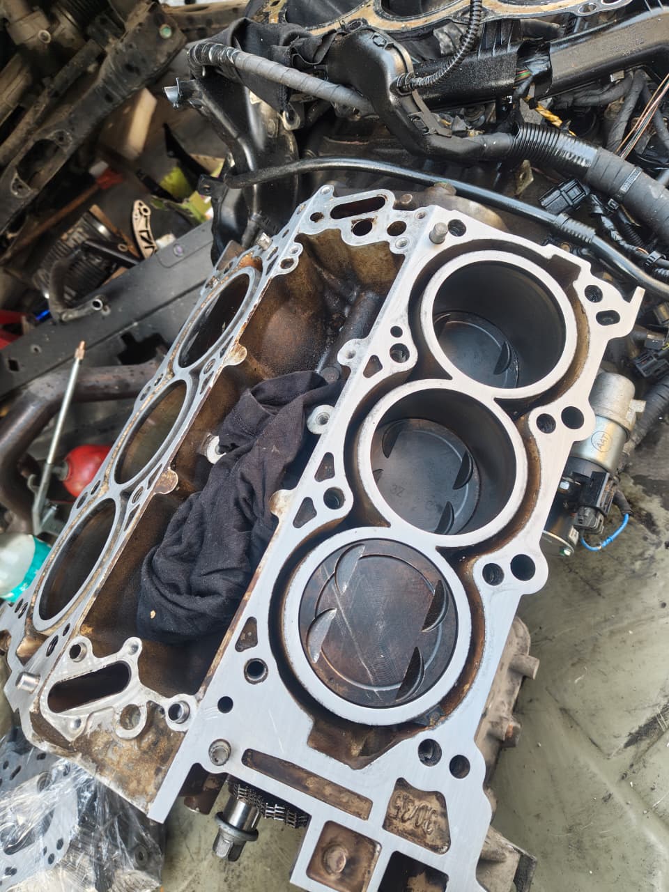 Engine block cylinder bores exposed during a rebuild