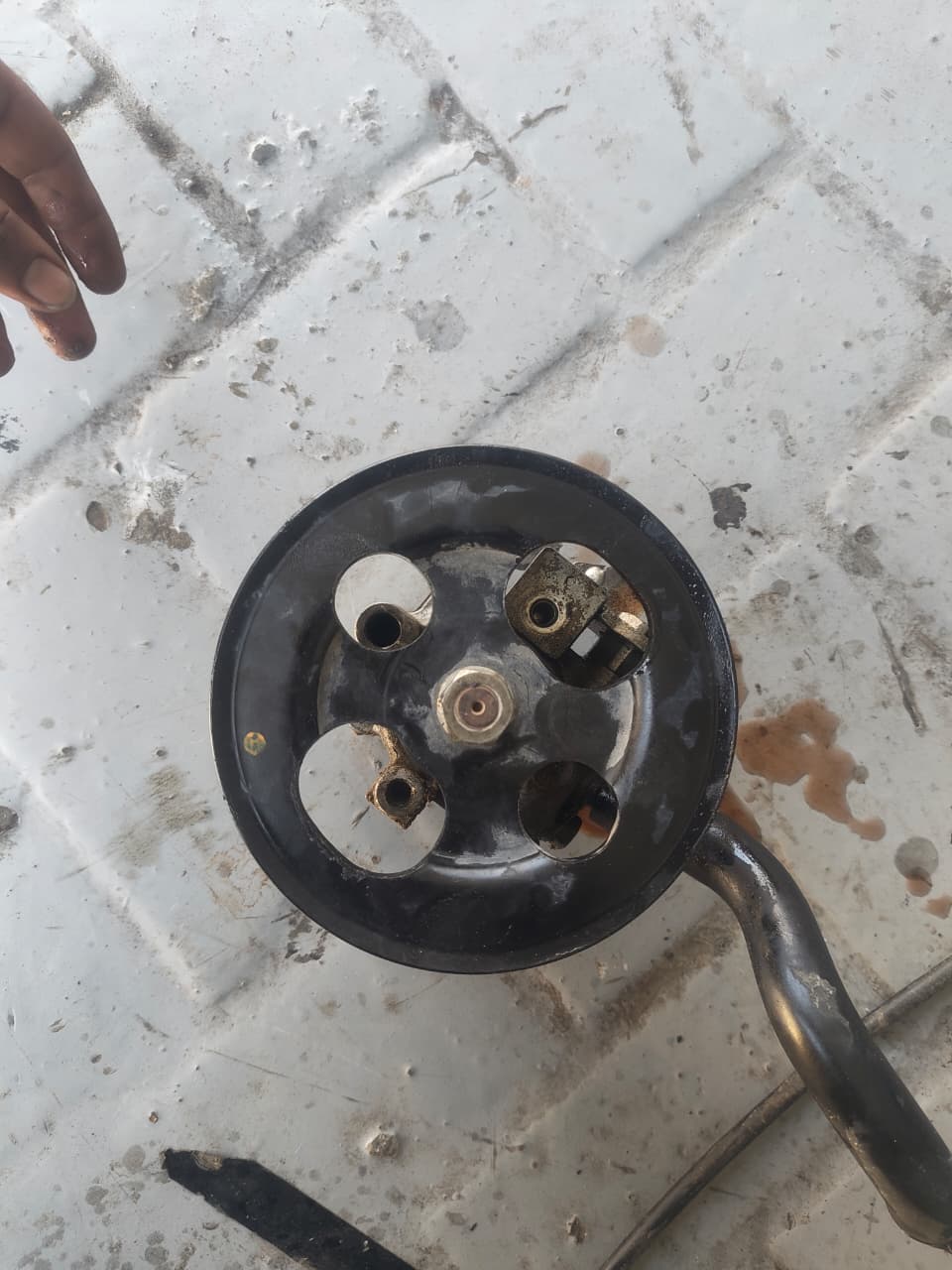 Power steering pump removed for inspection