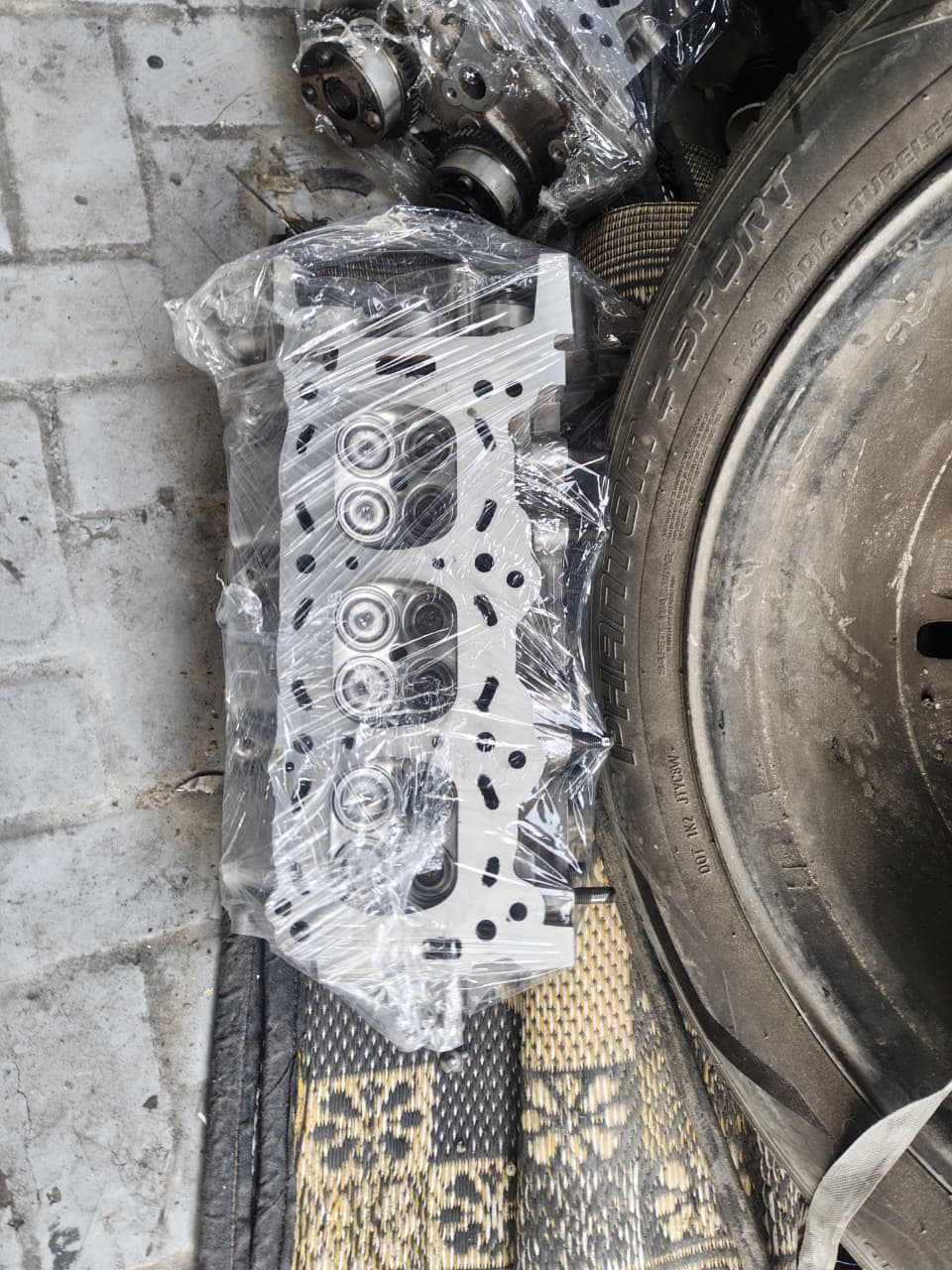 New replacement cylinder head ready for fitting