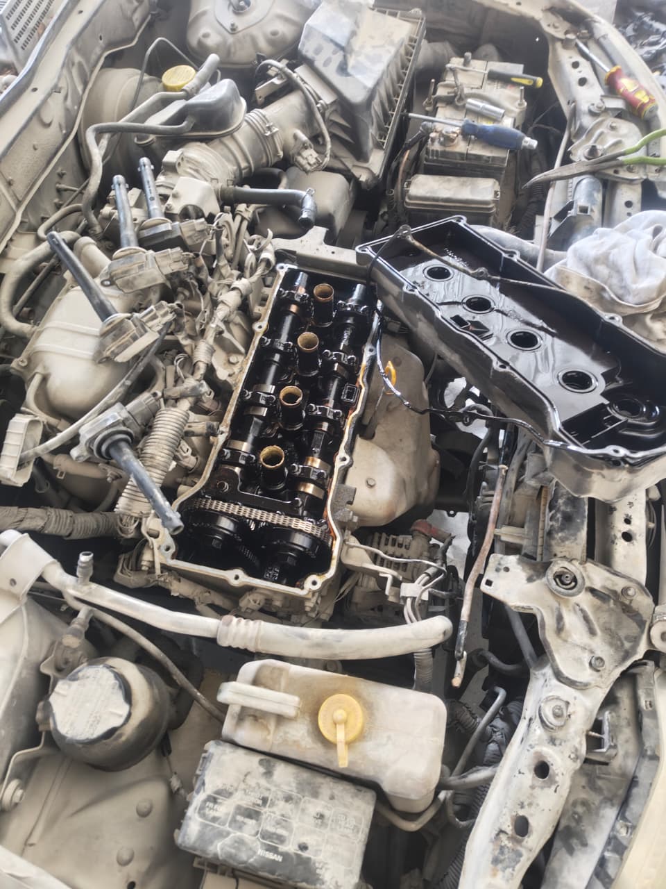 Valve cover removed for engine service